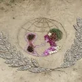 Logo de l'Unicef en land'art réalisé avec des éléments naturels : pierres, branches, fleurs, feuilles, graines......